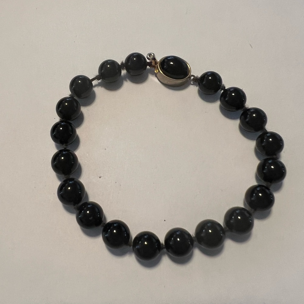 Vintage hand knotted black glass bracelet